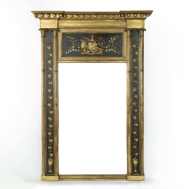 A large Nelson commemorative armorial pier glass. This George III giltwood mirror has a rectangular glass plate below a shaped cornice with a central coat of arms for Admiral Lord Nelson (1758-1805) flanked by foliate tendrils on a painted black