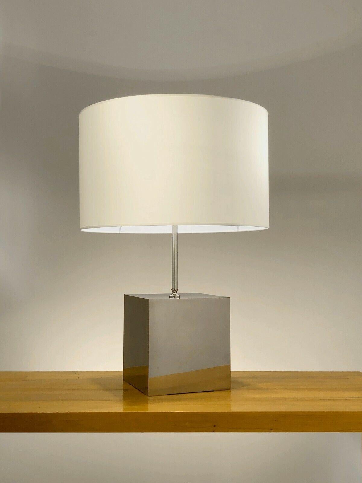 A very large and elegant table lamp, Post-Modernist, large cubic base in thick nickel-plated bronze plates, topped by a thin cylindrical axis and a beautiful circular lampshade, by Philippe Barbier, France 1970.