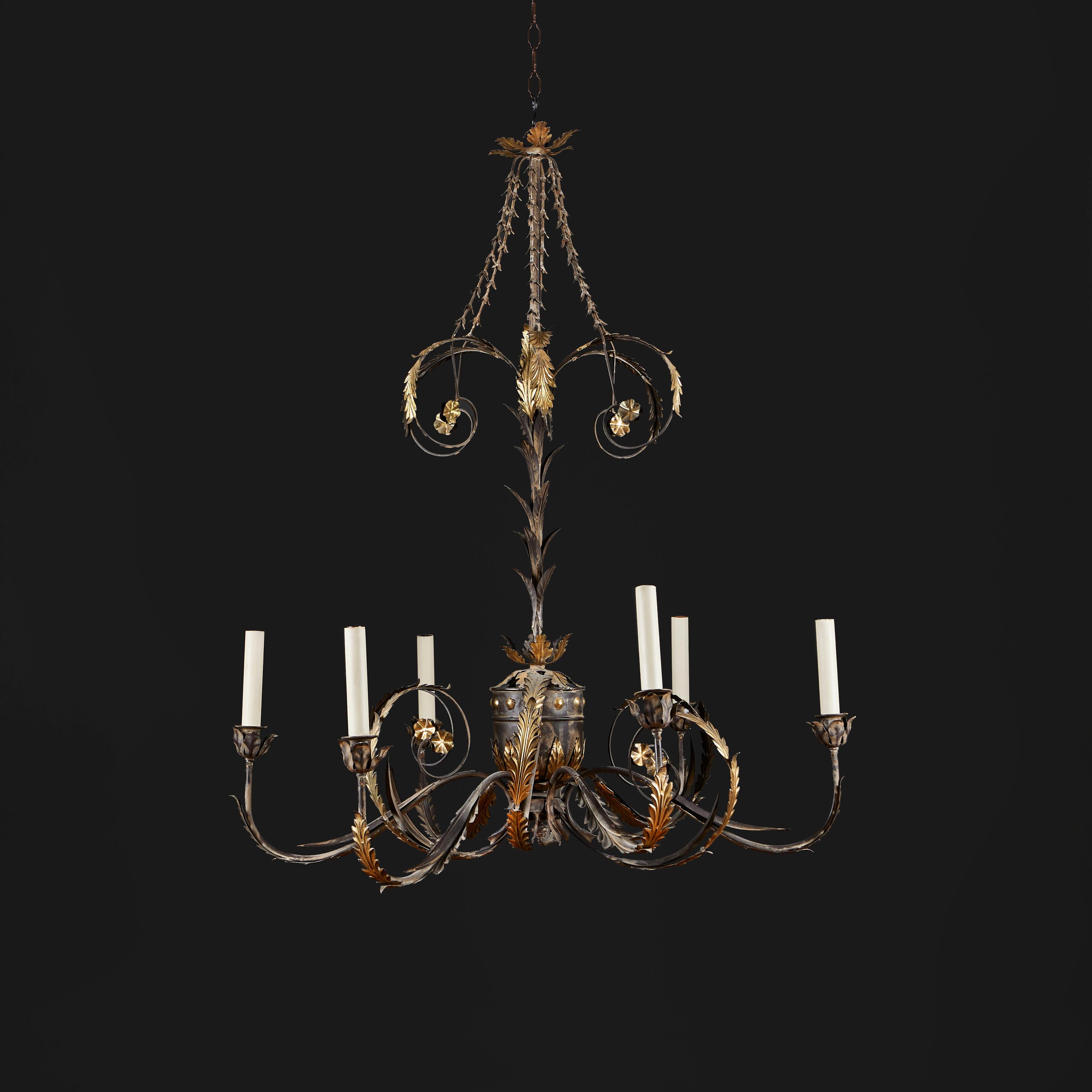A fine late nineteenth century painted tole chandelier of six arms with gilded foliate elements, central urn and flower husks, now electrified for electricity.
Italy, circa 1900

Height 114.00cm

Diameter 90.00cm
