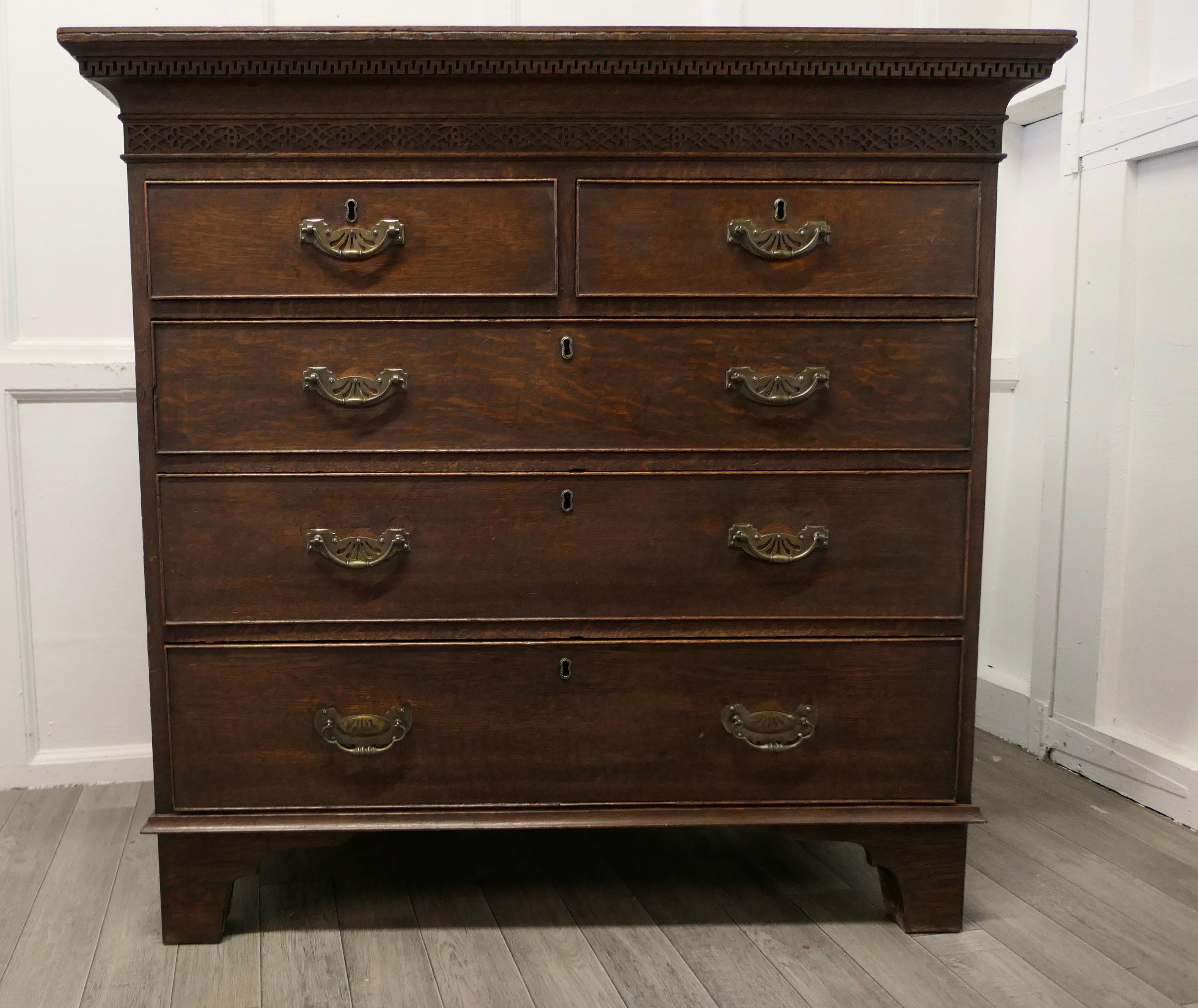 A large oak chest of drawers

This very attractive chest has two short drawers at the top and three graduated long drawers beneath, this is a heavy chest of drawers, it stands on a Bracket Footed Plinth and it has a solid oak top with an