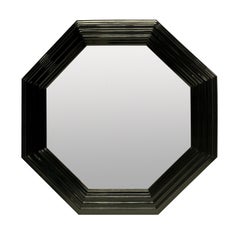 A Large Octagonal Black Lacquered Mirror