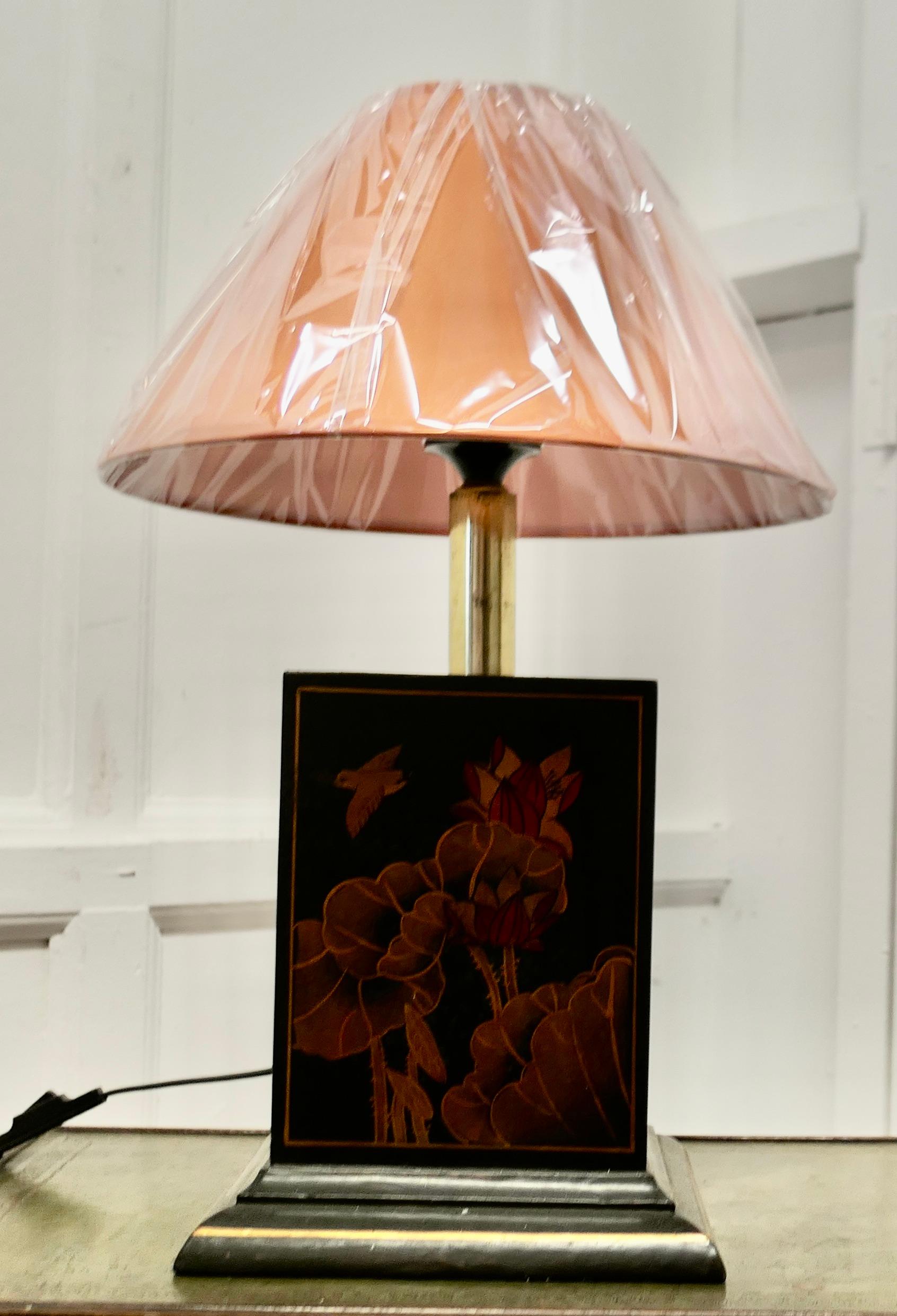 A Large Oriental Lacquer Cube Sideboard Lamp

The lamp is made in Wood and Brass, it is lacquered in Black with flowers and birds in shades of Sienna, the lamp comes with a new Coolie Lampshade
All working and a great looker
The lamp is 21” tall, 9”