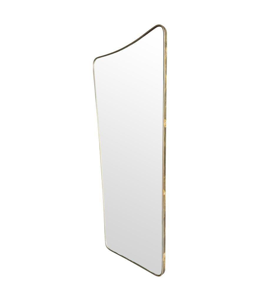 Brass A large original 1950s Italian shield mirror with For Sale