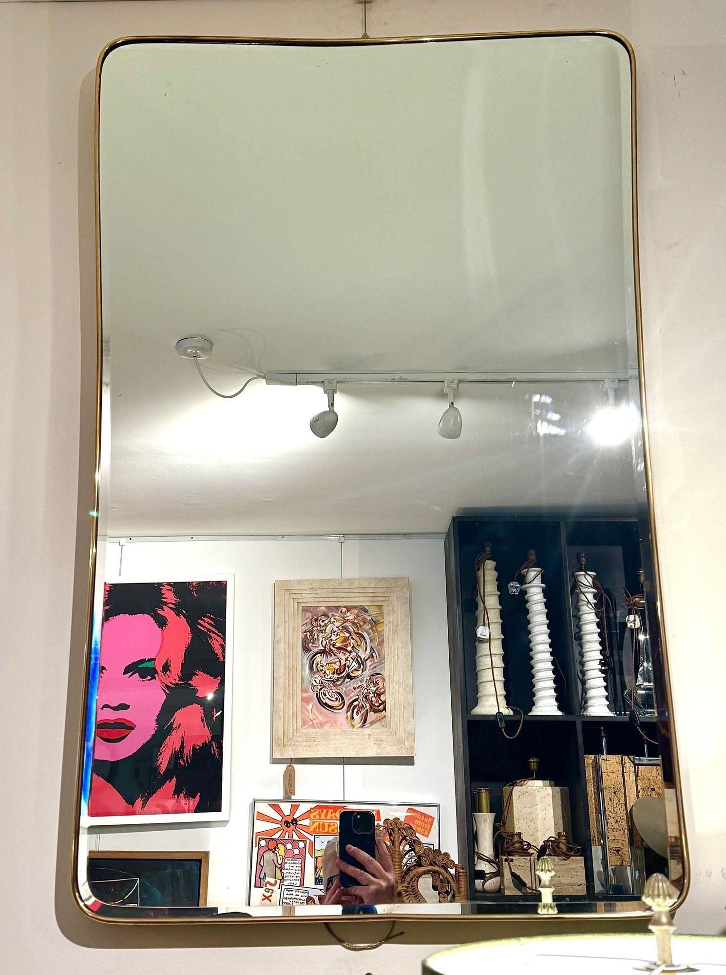 A large original Italian 1950s brass framed mirror with original bevelled plate In Good Condition For Sale In London, GB