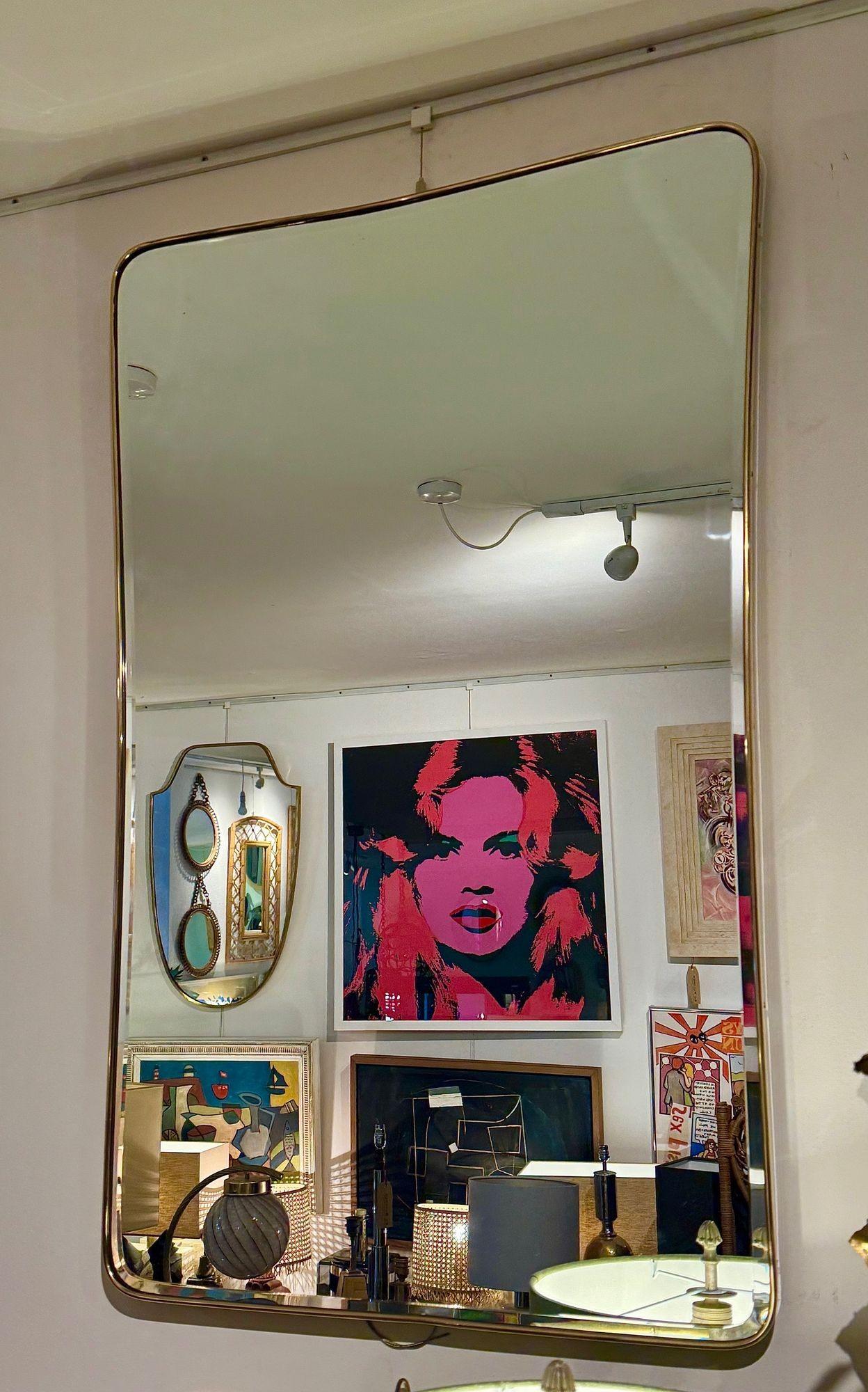 A large original Italian 1950s brass framed mirror with original bevelled plate For Sale 1