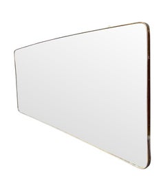 A large orignal 1950s Italian brass framed landscape mirror with curved corners