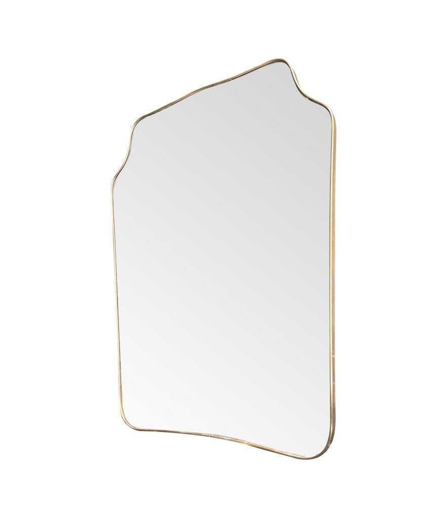 A large orignal 1950s Italian shield mirror with wonderful shaped brass frame, orignal plate and solid wood back.