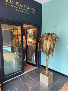 A large orignal 1970s Maison Jansen torch cut brass palm tree floor lamp