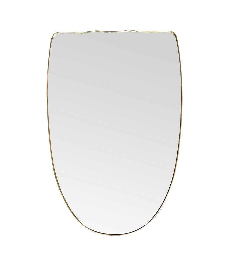 A large orignal Italian 1950s shield mirror with brass frame For Sale 4