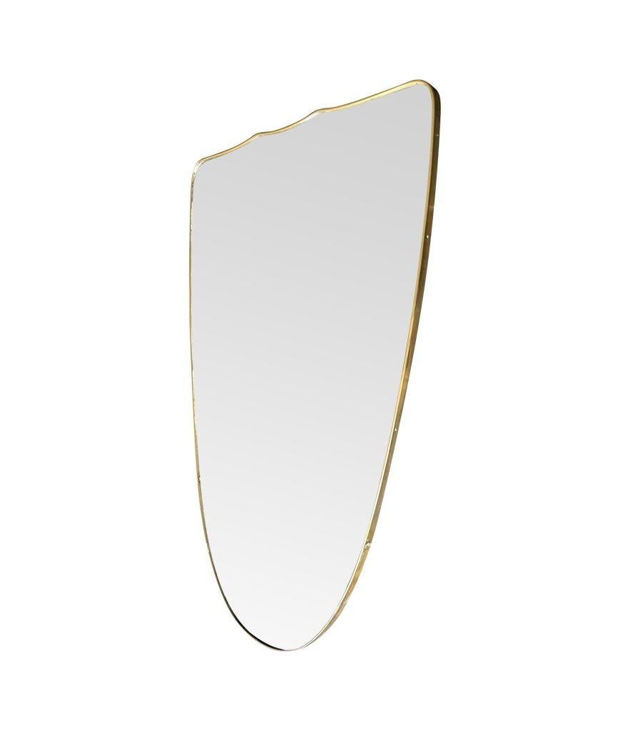 A large orignal Italian 1950s shield mirror with brass frame For Sale 6