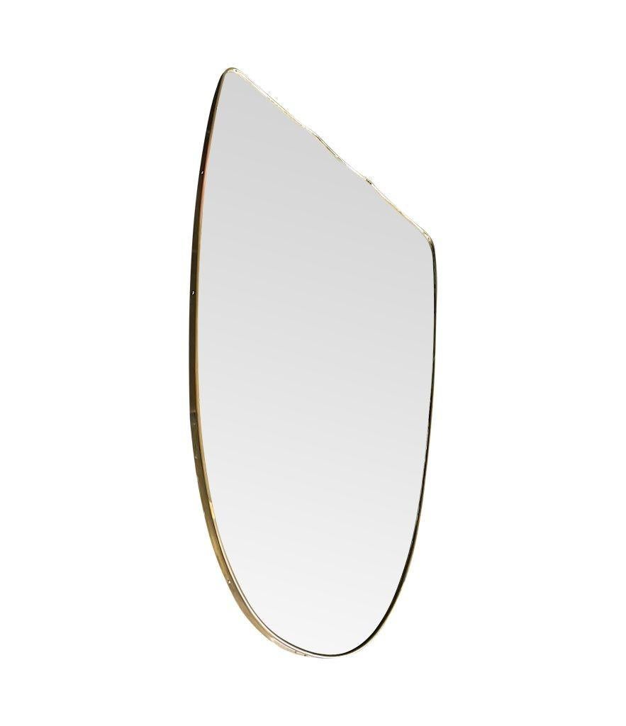 A large orignal Italian 1950s shield mirror with brass frame For Sale 7