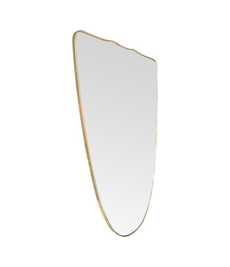 A large orignal Italian 1950s shield mirror with brass frame For Sale 8
