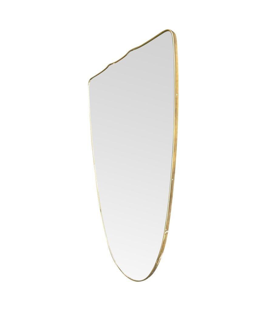 A large orignal Italian 1950s shield mirror with brass frame For Sale 9