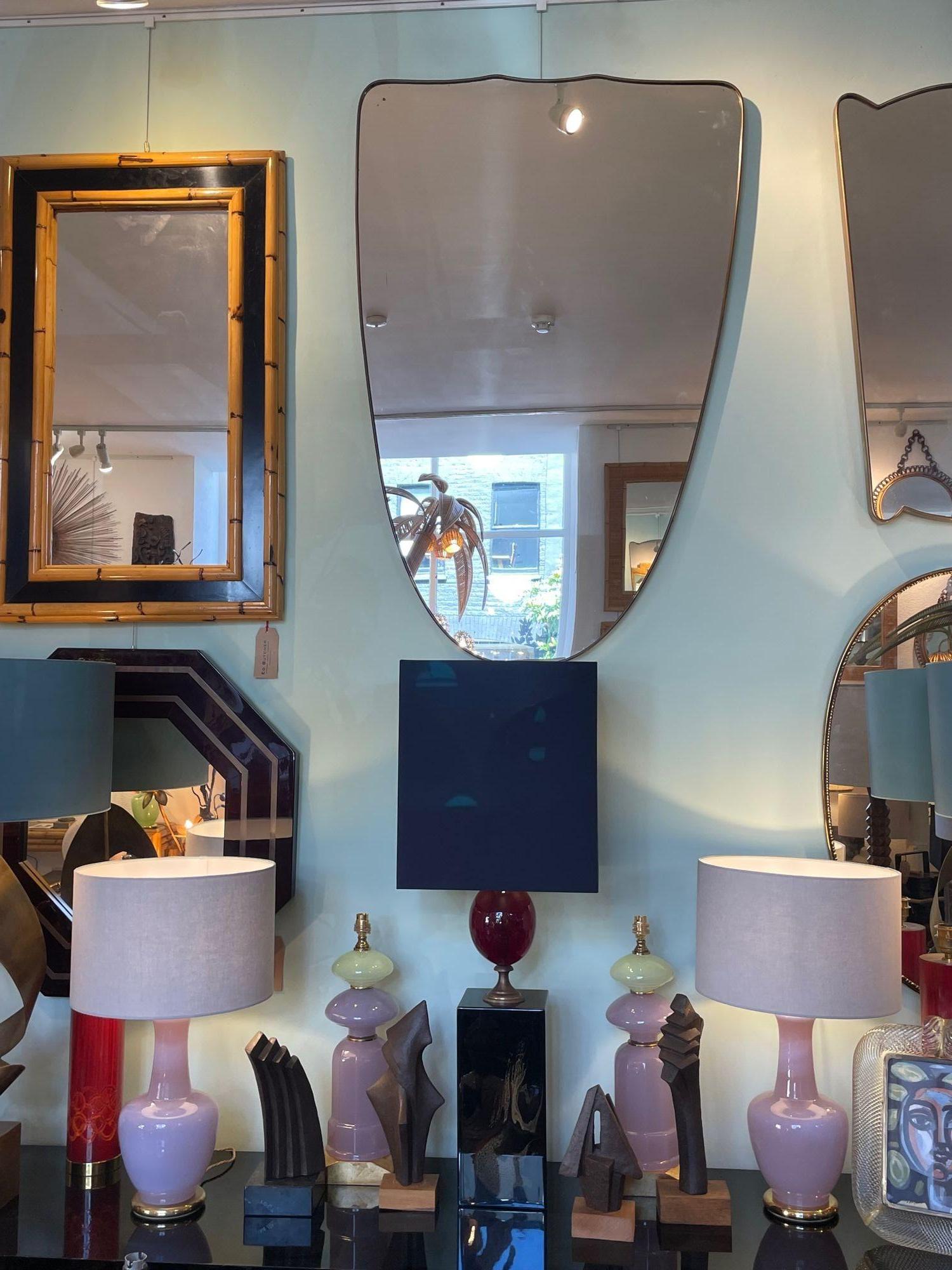 A large orignal Italian 1950s shield mirror with brass frame For Sale 10