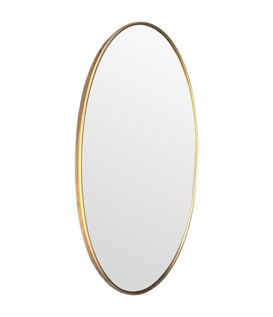 Mid-20th Century A large orignal Italian 1960s oval brass framed mirror For Sale