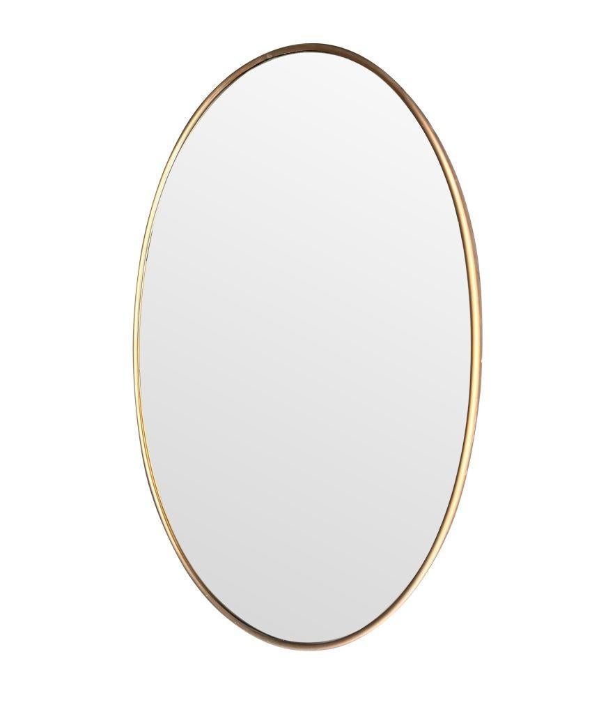 A large orignal Italian 1960s oval brass framed mirror For Sale 1