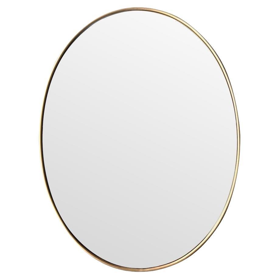 A large orignal Italian 1960s oval brass framed mirror For Sale