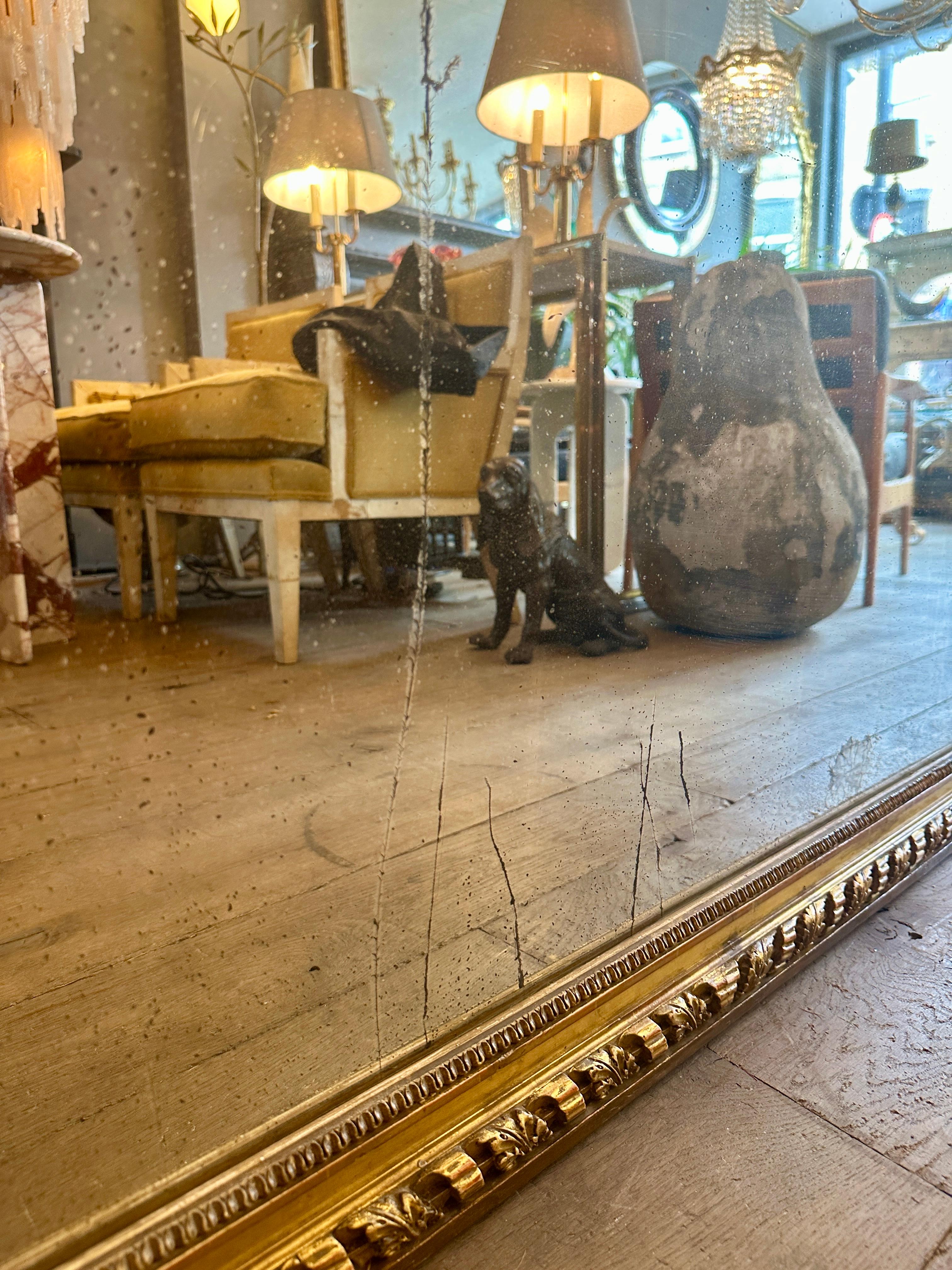 Carved A Large Ornate French Overmantel Gold Gilt Louis XVI Style Mirror For Sale
