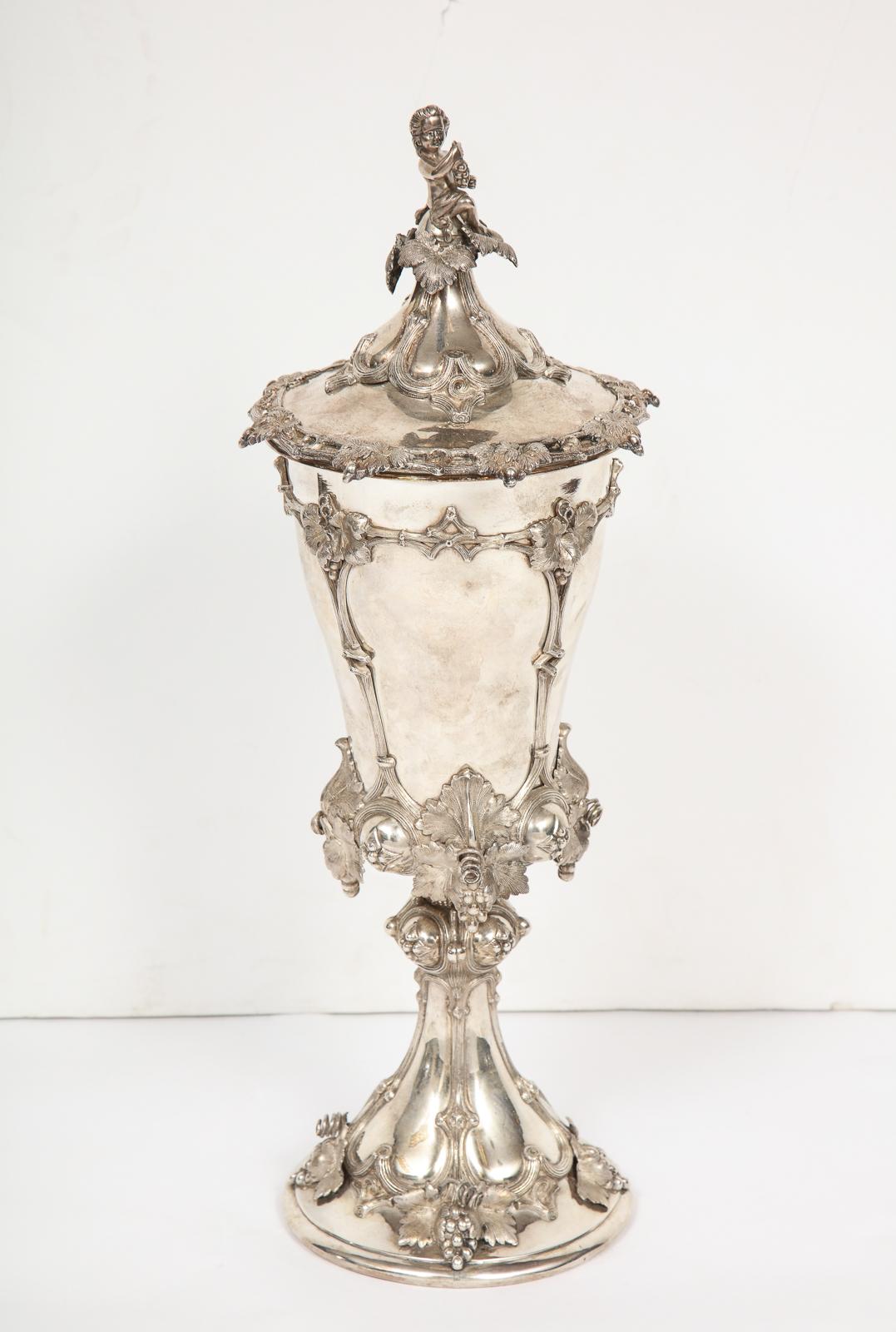 A large antique oversized German silver goblet cup with cover, circa 1900

Marked 800 and also marked 