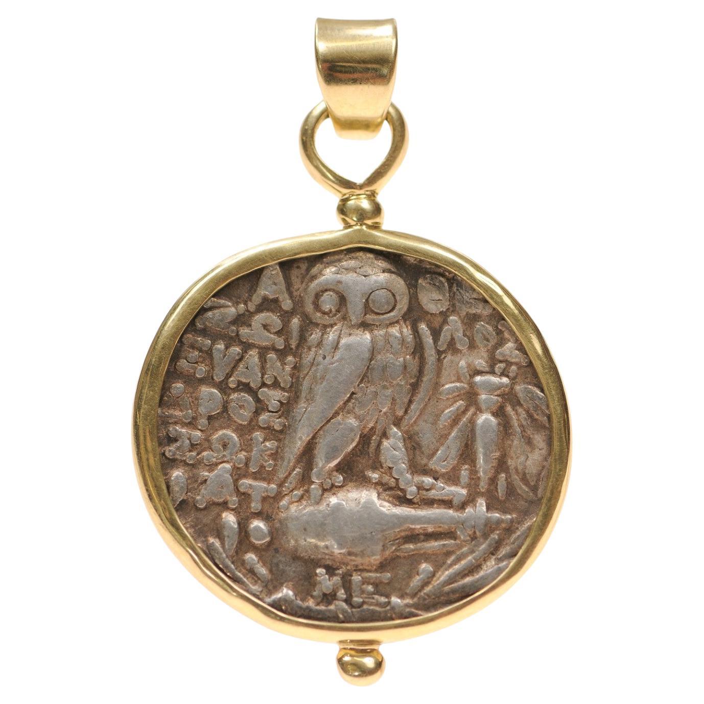 A large Owl [coin] pendant with 18 karat gold trim (pendant only)