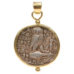 A large Owl [coin] pendant with 18 karat gold trim (pendant only)