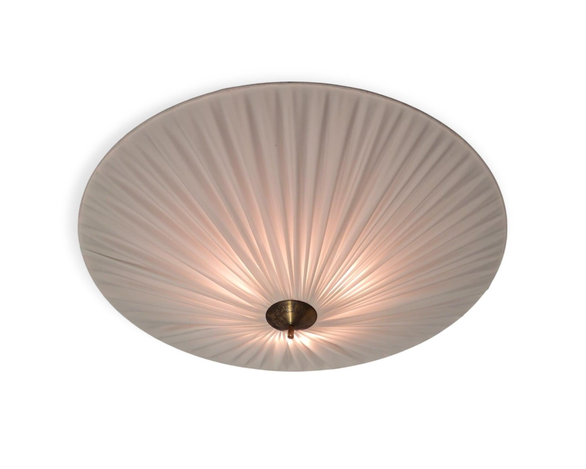 A faboulus commissioned ceiling pendant designed by Paavo Tynell and manufactured by Idman in Finland in the 1950s. This lamp is exceptionally large and impressive being 1 meter (3.2 ft) in diameter. With such measurements this impressive lamp has a