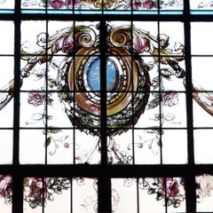 Gran vidriera pintada y emplomada con marco de hierro, hacia 1900