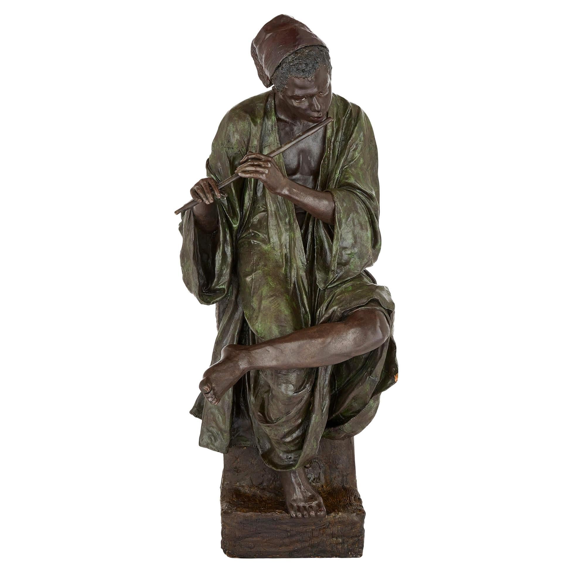 Large Painted Terracotta Figure of a Boy Playing the Flute by Goldscheider