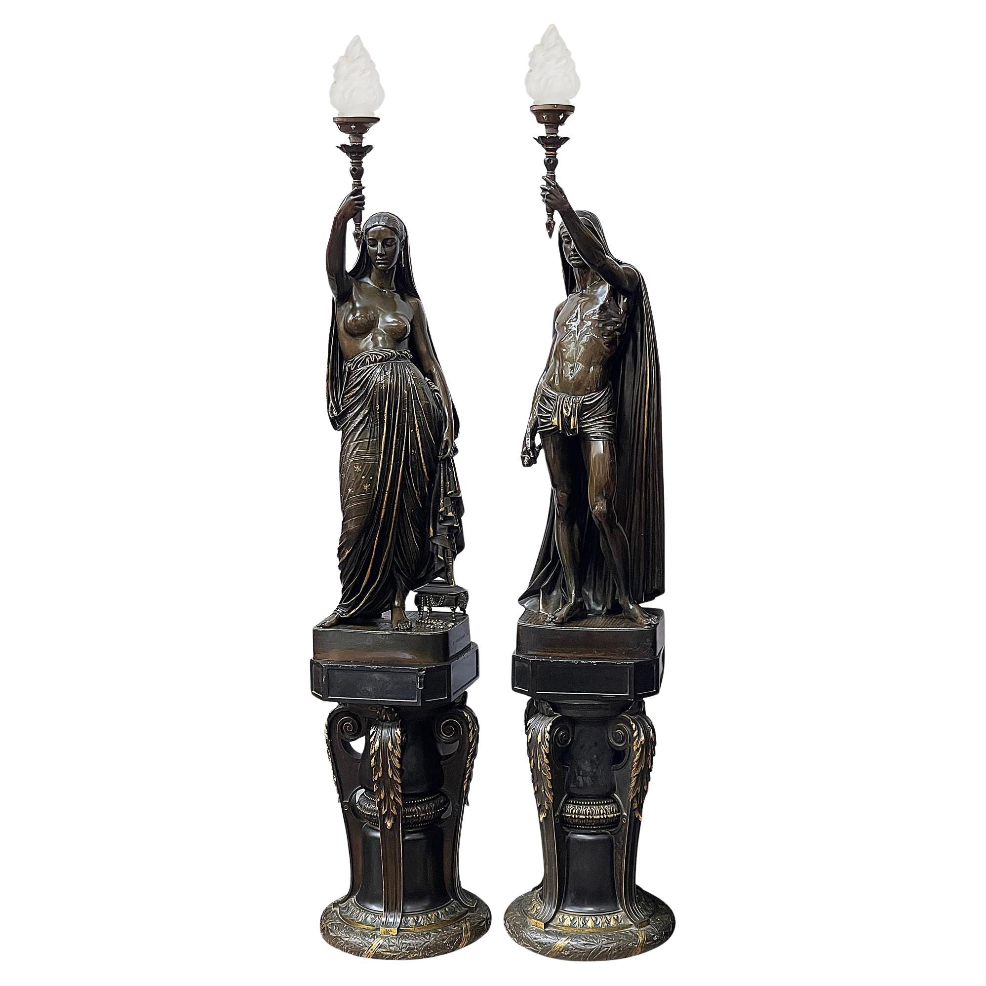 A large pair French 19th century patinated bronze figural torchès For Sale