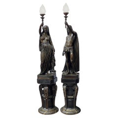 Antique A large pair French 19th century patinated bronze figural torchès