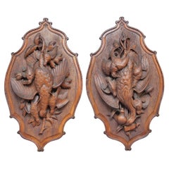 A large pair of 19th Century black forest plaques 