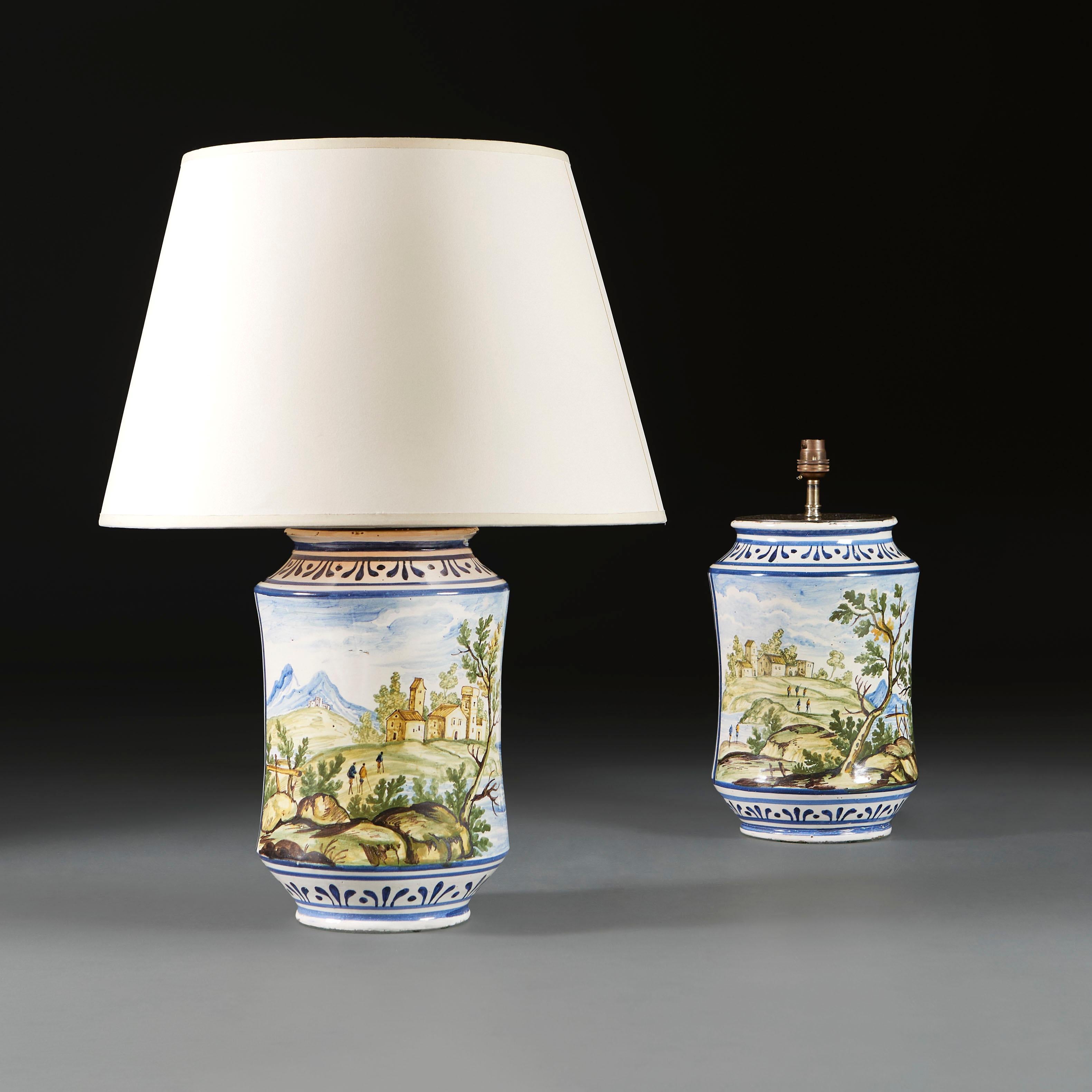Italy, circa 1860

A fine pair of nineteenth century Albarello vases, painted with Arcadian scenes of Italian rural life, the backs painted with the letters ELV, now mounted as lamps.

Photographed with 18” diameter pale cream card Pembroke