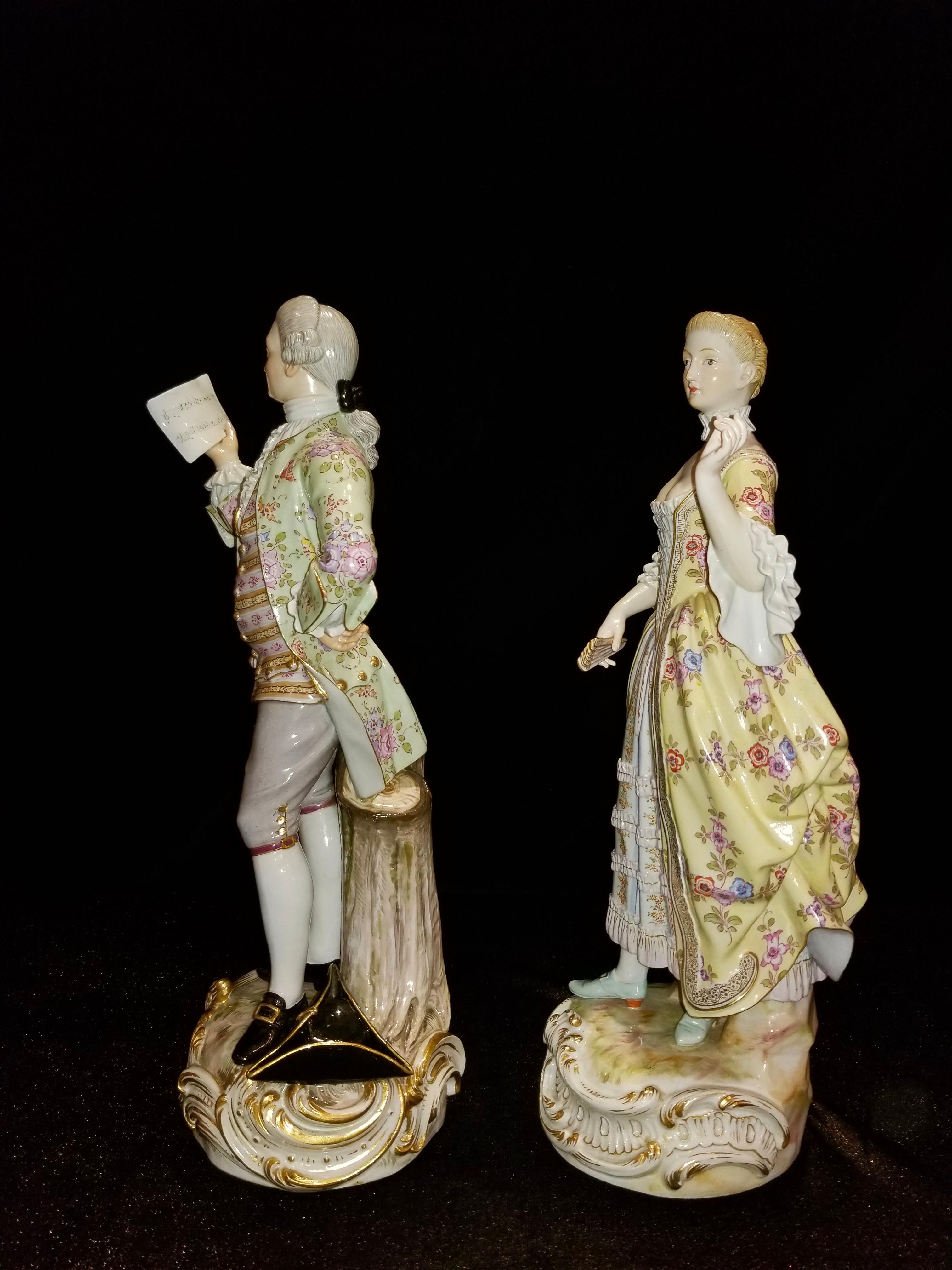 A beautiful and quite large pair of 19th century Meissen porcelain figures of Lovers Singing. Each figure is beautifully decorated and hand-painted. The gentleman is wearing a three-piece suite with a vibrant green jacket decorated with flowers and