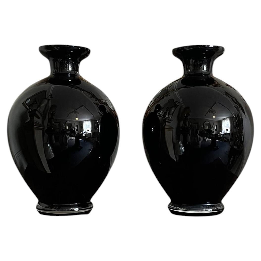 A large pair of 20th C decorative black glass vases