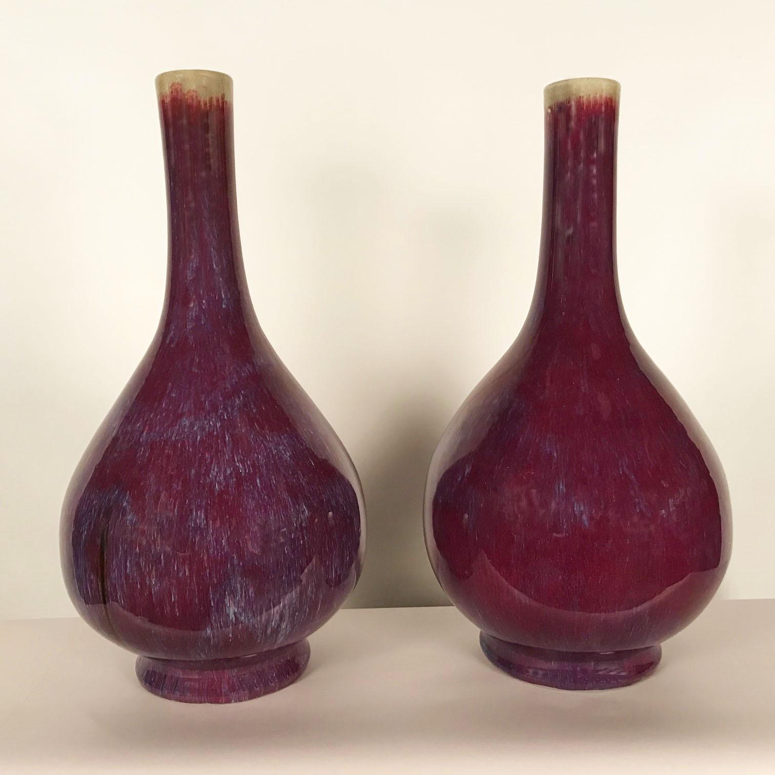 This pair are of a color that has more purple than sang-de-bouf has typically. I hope our photos catch the subtlety of the shade. It is difficult to describe such a nuanced and complex tone. They are not precisely the same size but are very slightly