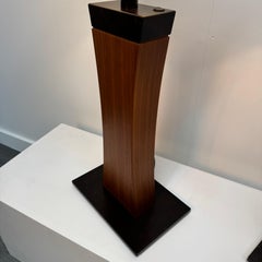 A large pair of architectural wood and metal table lamps