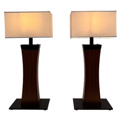 A large pair of architectural wood and metal table lamps