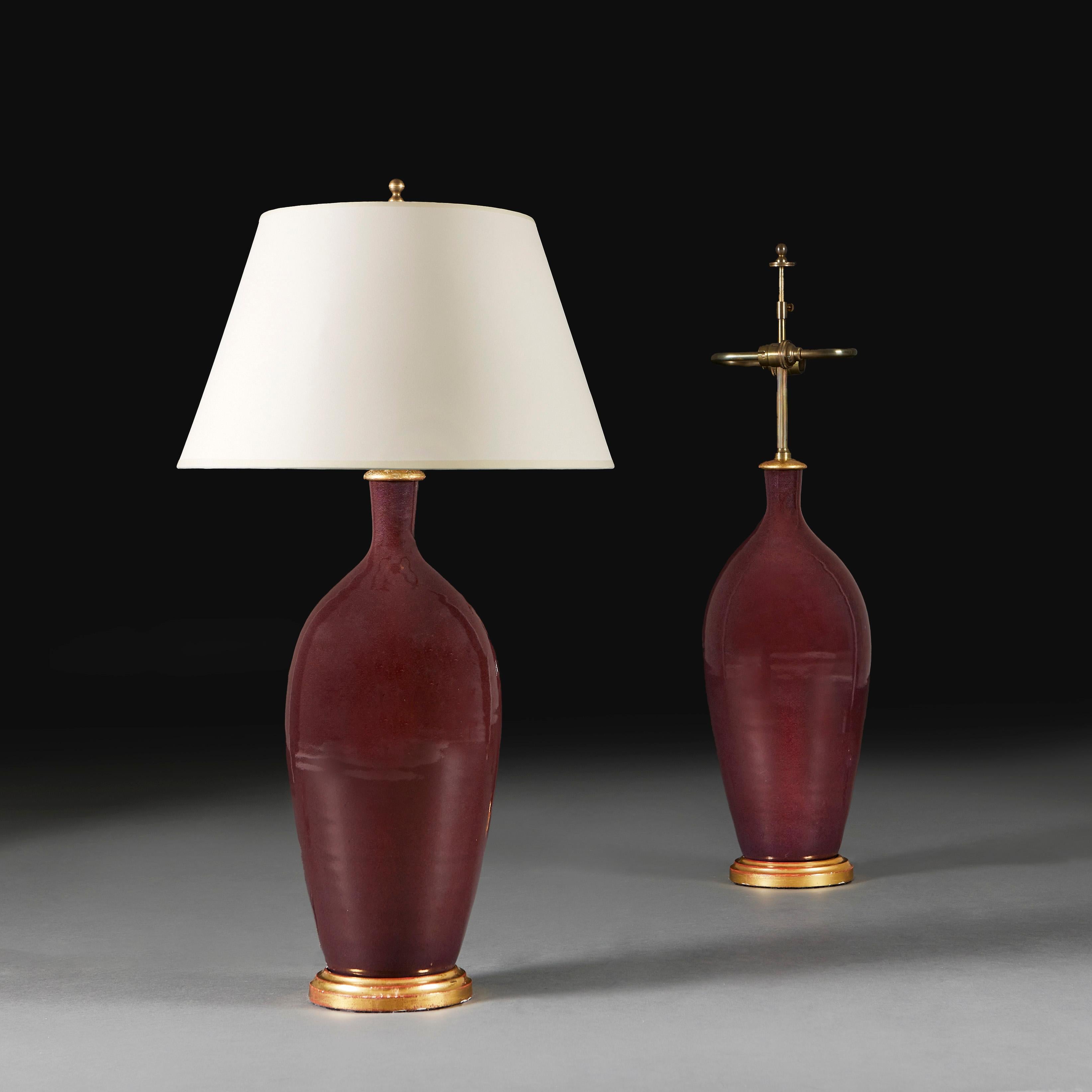 A fine pair of large flambe vessels incised with the initials RS to the rear, for Rupert Spira, now converted as lamps with giltwood bases. 

Rupert Spira was born in London in 1960. He earned his degree at West Surrey College of Art and later on