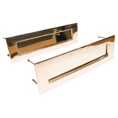 A large pair of brass letterboxes by Pearson of Birmingham