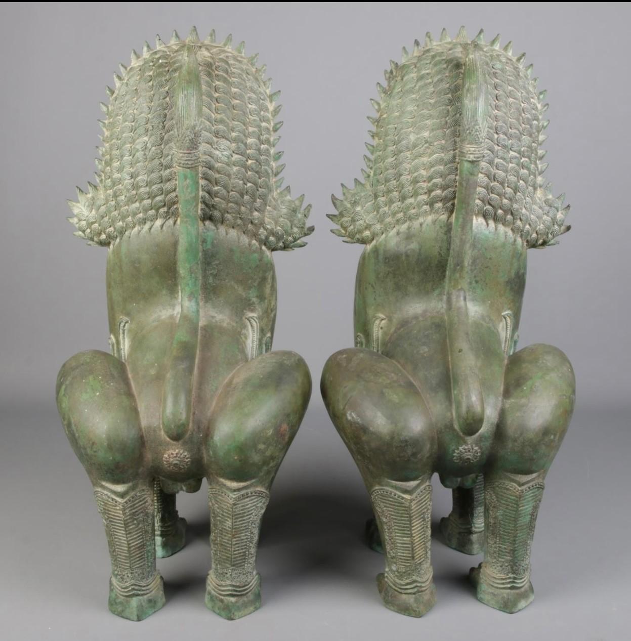 A large pair of bronze khmer sculptures modelled as temple lions.

These Lion sculptures represent images of royalty and imposing presences giving impressions of figures at the courts with considerable power.
Khmer sculptures are from the Hindu