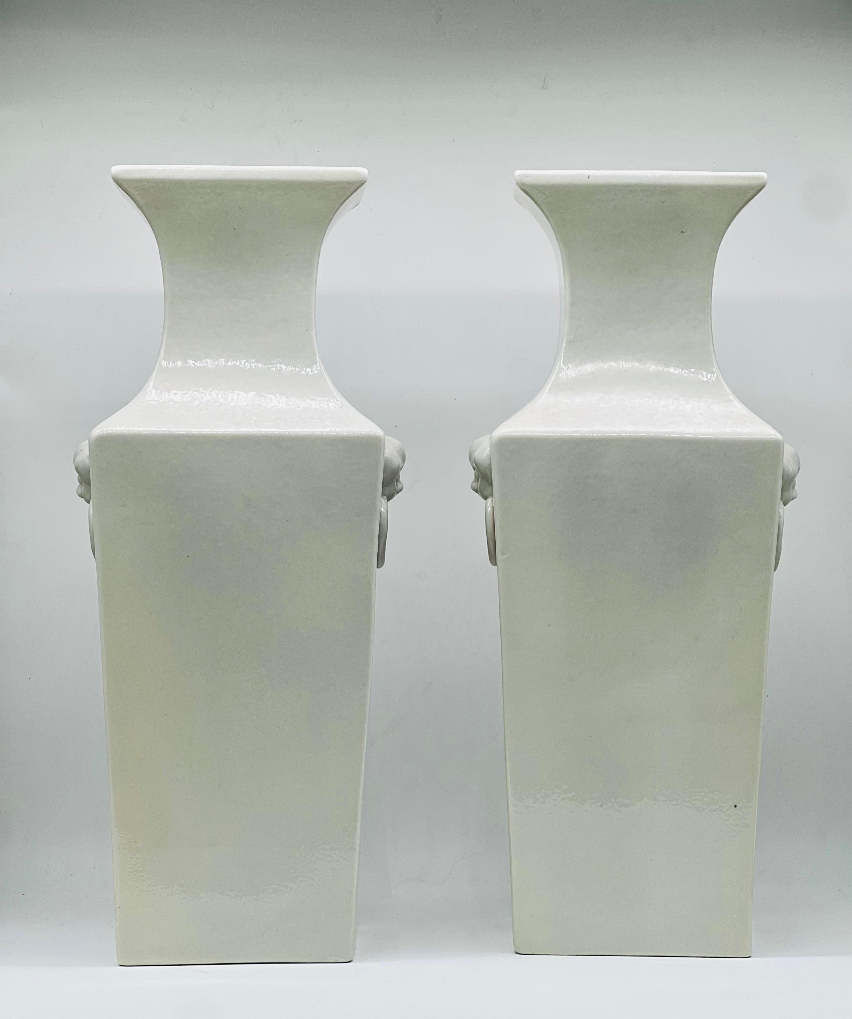A large pair of Chinese Blanc de Chine Vases. Republic period. Early 20th C


A Fine and very large pair of Chinese blanc de chine vases dating from the early 20th C. Republic period of China. 
The tall square body has a raised mouth, two lion dog