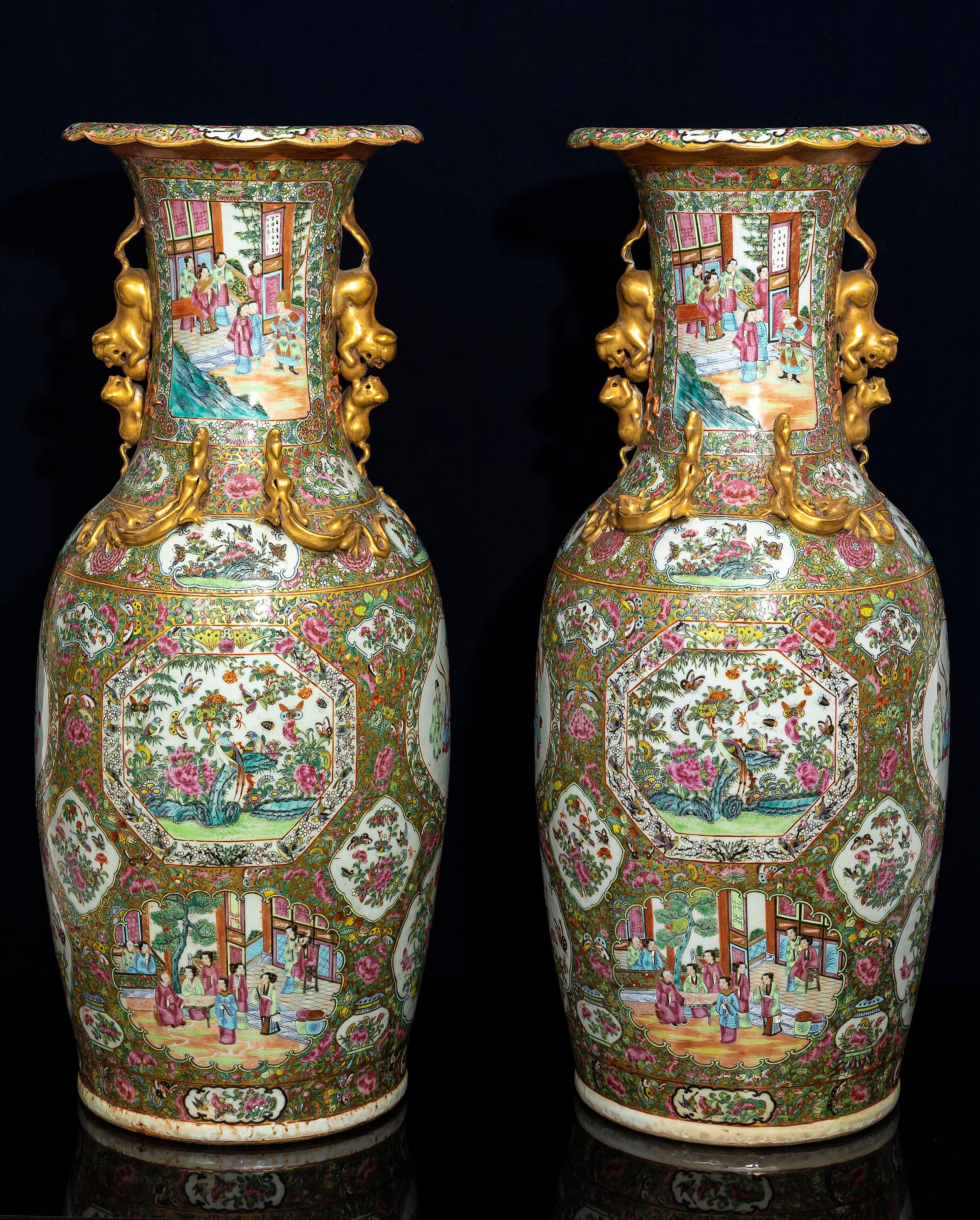 A Large Pair of Chinese Famille Rose Decorated Gilt Foo Dog Handle Vases In Good Condition For Sale In New York, NY