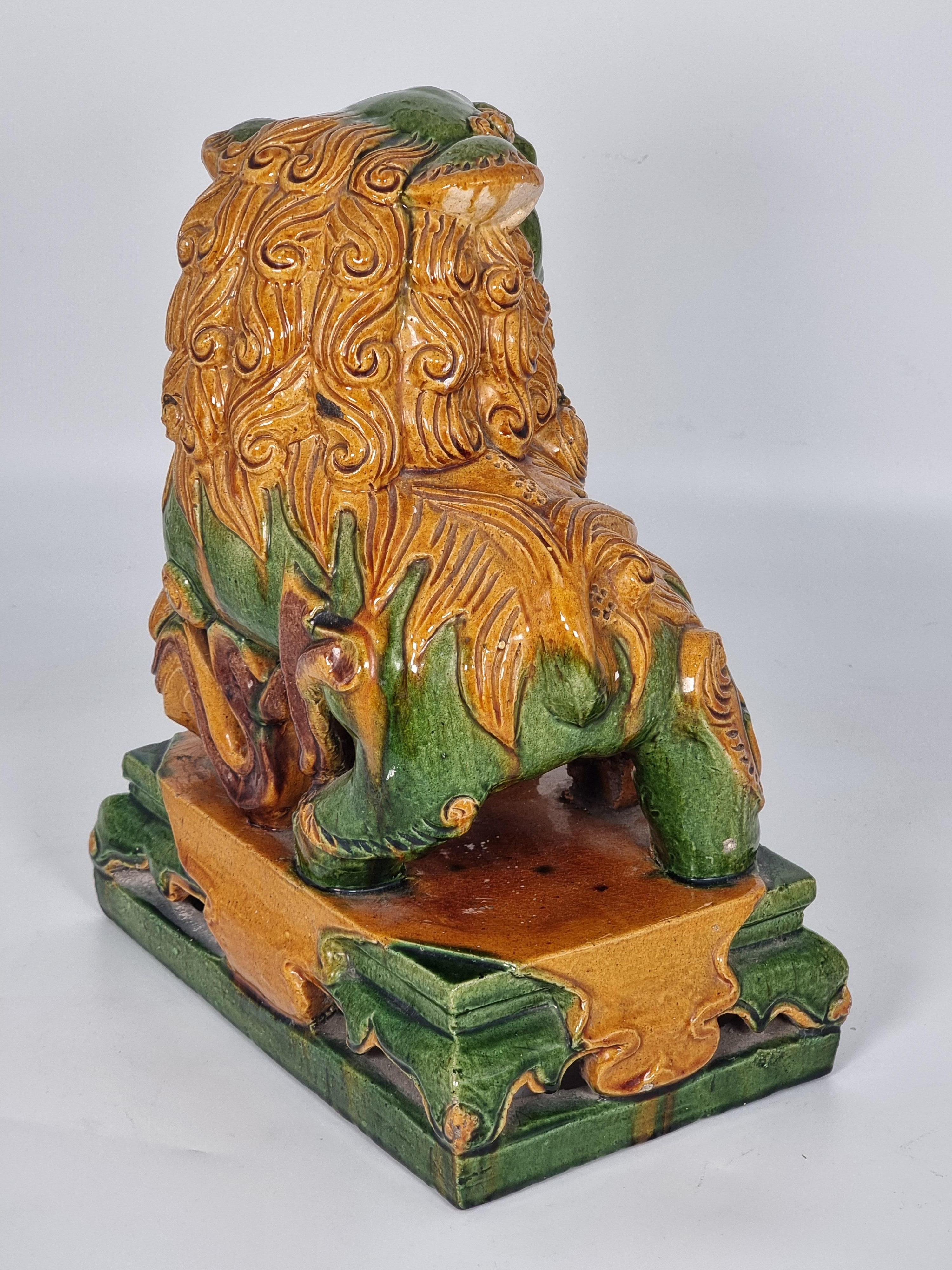 A large pair of Chinese pottery Foo Dogs, circa 1900 12