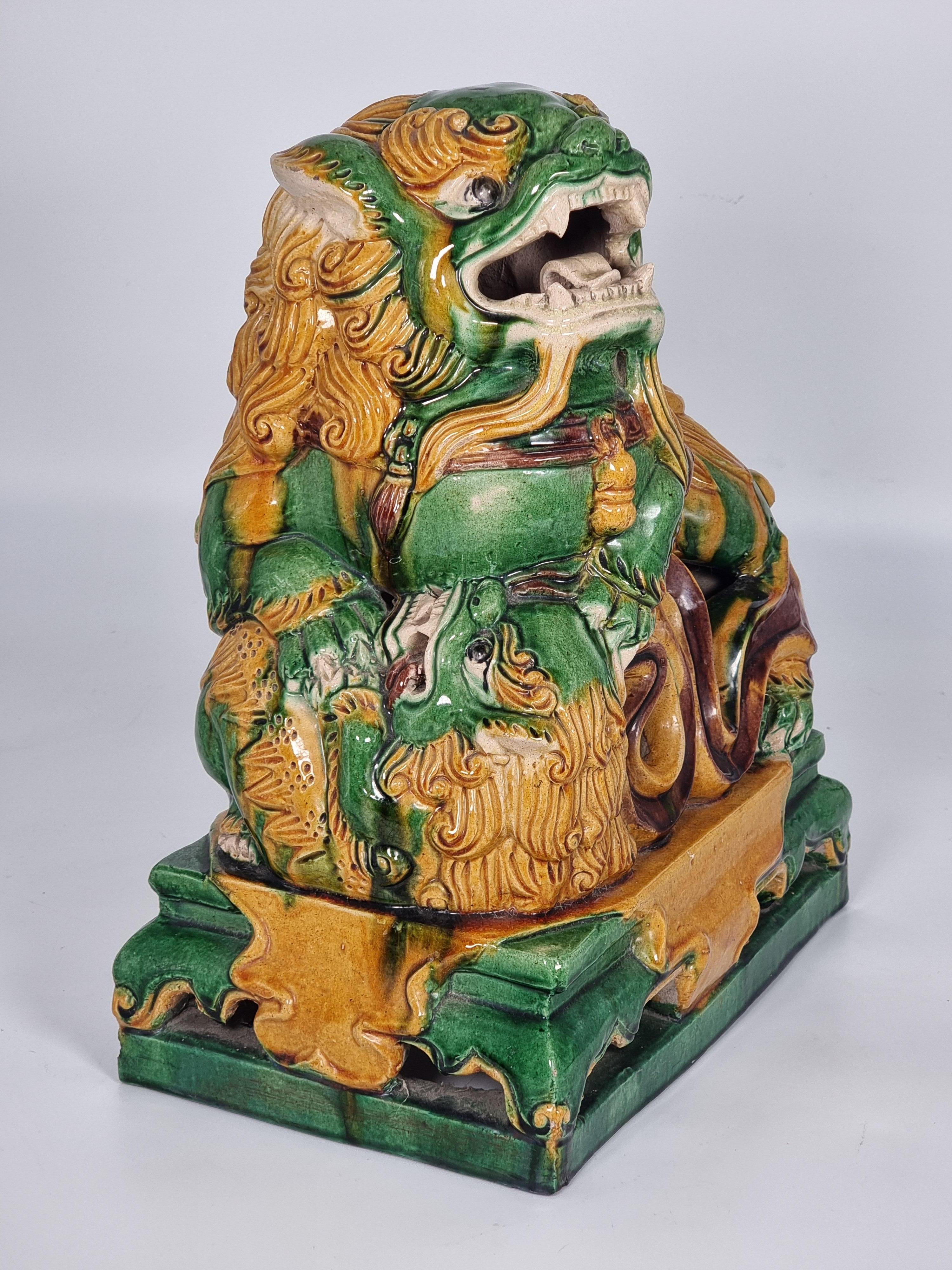 Hand-Carved A large pair of Chinese pottery Foo Dogs, circa 1900