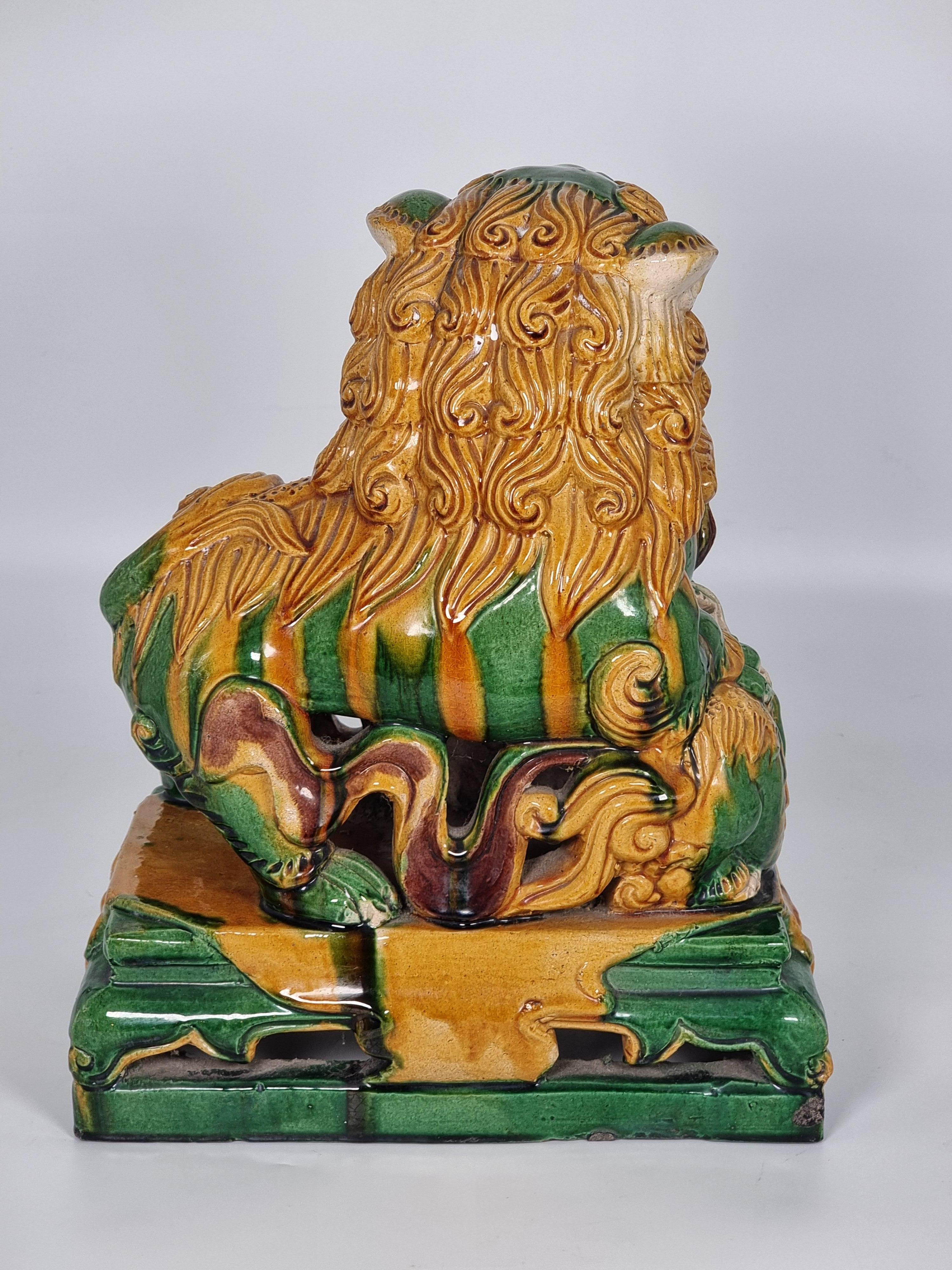 Pottery A large pair of Chinese pottery Foo Dogs, circa 1900