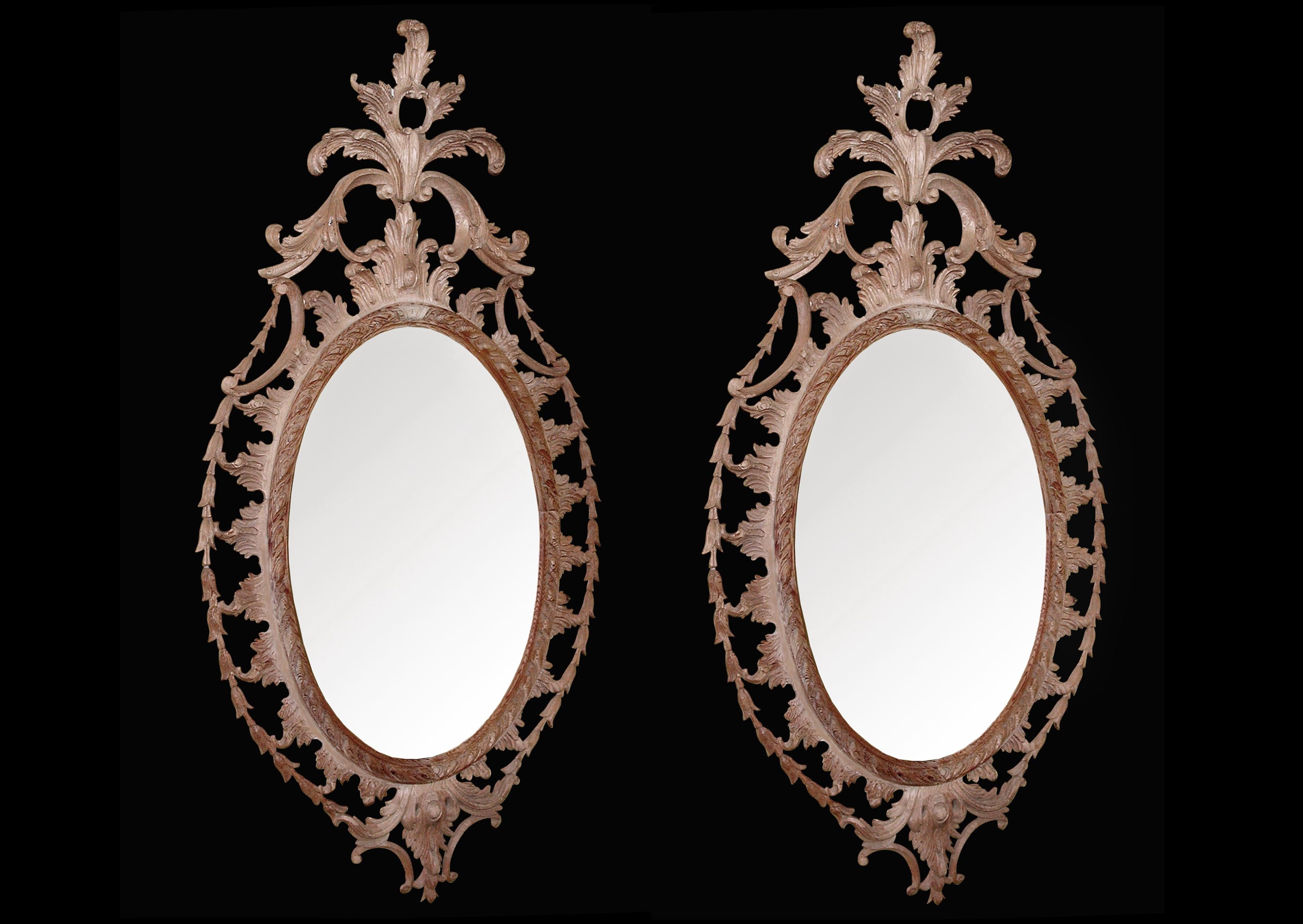 A large pair of Chippendale style carved pine oval mirrors with bellflower trim, the top with leaves scrolls and foliage.

Shelf Width: 1310 mm 51 ?