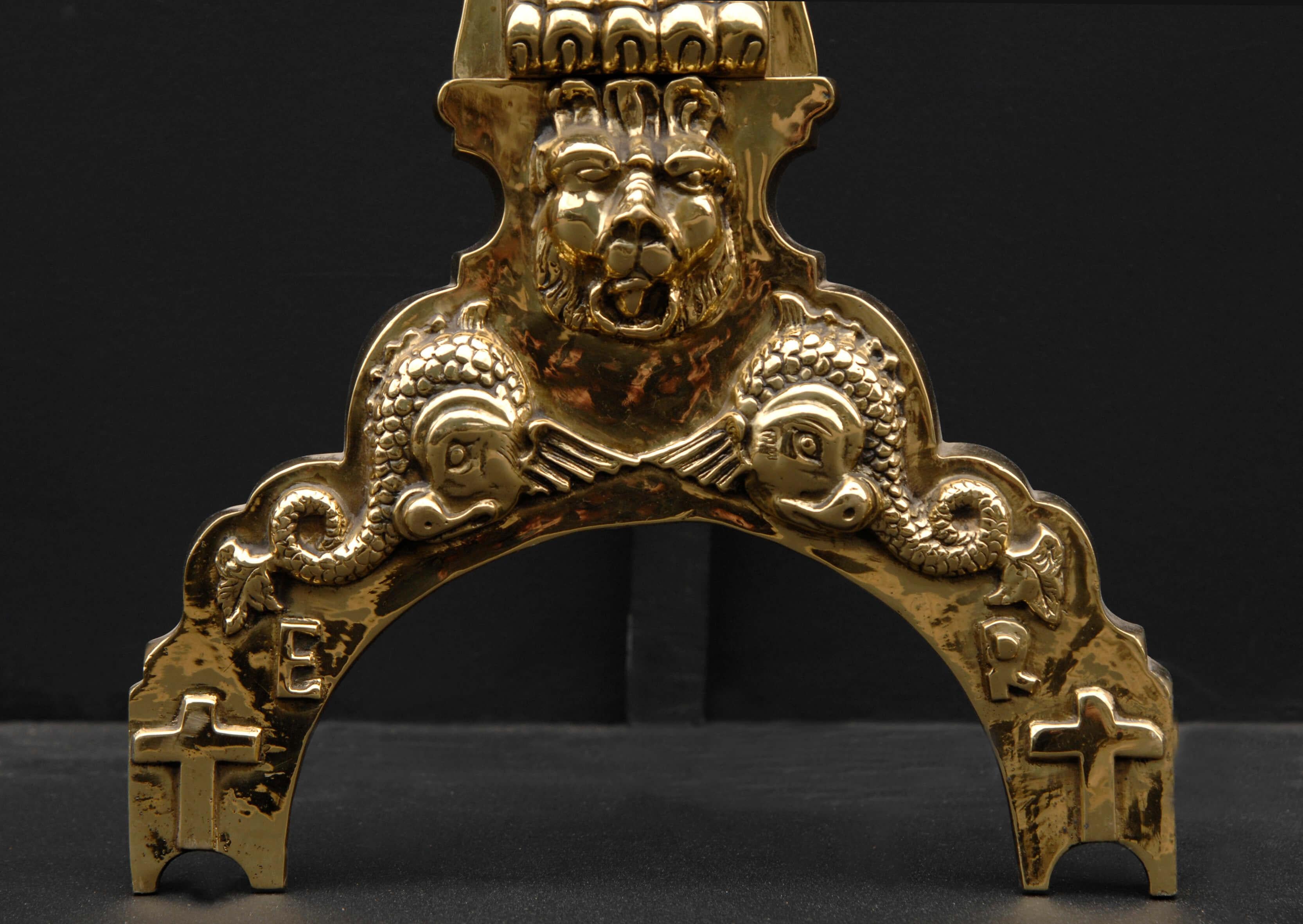 Pair of good quality late 19th century brass firedogs, in the early 17th century style, lion masks to arched feet.

Height:	855 mm      	33 ⅝