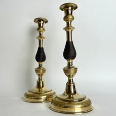 A large pair of Empire Candlesticks in gilt and dark patinated bronze. 1820s