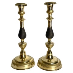 Gran pareja de candeleros Imperio en bronce dorado y patinado oscuro. 1820s