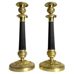 Gran pareja de candeleros Imperio en bronce dorado y patinado oscuro. 1820s